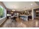 Spacious kitchen with a large island, stainless steel appliances, and adjacent dining area with great natural light at 2263 S Loveland St, Lakewood, CO 80228