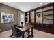 Spacious home office with built-in bookcase, natural light, and ample workspace at 2263 S Loveland St, Lakewood, CO 80228