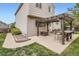 Backyard patio features a pergola and outdoor seating, perfect for entertaining at 11864 N Chase Ct, Westminster, CO 80020