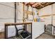 Unfinished basement laundry area with working washer, dryer, and utility sink at 11864 N Chase Ct, Westminster, CO 80020