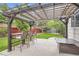 A covered pergola with outdoor dining set creates a cozy backyard setting at 11864 N Chase Ct, Westminster, CO 80020