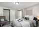 Serene bedroom with a comfortable bed, decorative accents, and ample storage for a relaxing atmosphere at 1390 Everett Ct # 105, Lakewood, CO 80215