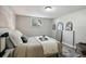 Cozy bedroom featuring a comfortable bed, soft lighting, and serene decor for relaxation at 1390 Everett Ct # 105, Lakewood, CO 80215