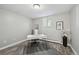 Inviting bedroom features a sleek desk with gold legs, a cozy chair, and modern decor, bathed in natural light at 1390 Everett Ct # 105, Lakewood, CO 80215