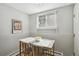 Bright dining area with natural light and a stylish table perfect for enjoying meals at 1390 Everett Ct # 105, Lakewood, CO 80215