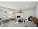 Inviting living room showcasing fireplace, decor, and comfortable seating at 1390 Everett Ct # 105, Lakewood, CO 80215