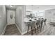 Bright, updated living space featuring an open-concept design and a door leading out at 1390 Everett Ct # 105, Lakewood, CO 80215