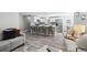 Bright, open-concept layout featuring eat-in kitchen with seating, and modern appliances at 1390 Everett Ct # 105, Lakewood, CO 80215