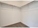 A walk-in closet equipped with shelving, rod, and carpeted floor at 1965 S Haleyville Way, Aurora, CO 80018