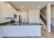 Modern kitchen featuring white cabinets, stainless steel appliances, and a spacious island at 1965 S Haleyville Way, Aurora, CO 80018