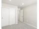 Bedroom features neutral carpet, closet with sliding doors, and open doorway at 764 N Tempe St, Aurora, CO 80018