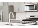 Close up of a modern kitchen with stainless steel appliances at 764 N Tempe St, Aurora, CO 80018