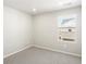 Carpeted bedroom featuring a window offering natural light, painted in neutral colors at 764 N Tempe St, Aurora, CO 80018