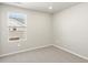 Carpeted bedroom with a window offering natural light, painted in neutral colors at 764 N Tempe St, Aurora, CO 80018