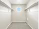 Walk-in closet with ample shelving and a window for natural light at 764 N Tempe St, Aurora, CO 80018