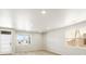 Spacious living room with ample natural light, neutral paint and nice wood flooring at 764 N Tempe St, Aurora, CO 80018