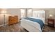 Serene bedroom with a comfortable bed, stylish dresser, and natural light from the windows at 200 N Holcomb St, Castle Rock, CO 80104