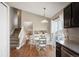 Bright dining area featuring a round table, hardwood floors, and sliding glass doors to the outside at 200 N Holcomb St, Castle Rock, CO 80104