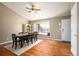 Bright dining room featuring beautiful hardwood floors, ample natural light, and adjacent front door at 200 N Holcomb St, Castle Rock, CO 80104