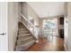 View of the dining area and staircase featuring hardwood floors, light paint colors, and a sliding glass door at 200 N Holcomb St, Castle Rock, CO 80104