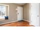 Welcoming entryway with hardwood floors, window seat, and a white front door providing a warm and inviting space at 200 N Holcomb St, Castle Rock, CO 80104