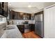 Well-equipped kitchen featuring granite countertops, stainless steel appliances, and ample cabinet space for storage at 200 N Holcomb St, Castle Rock, CO 80104