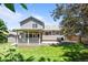 Beautiful backyard with a covered patio and lush green lawn at 20858 E Progress Ave, Centennial, CO 80015