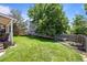 Spacious backyard with mature trees and well-maintained lawn at 20858 E Progress Ave, Centennial, CO 80015