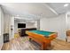 Spacious finished basement featuring a pool table, seating area and plenty of room for entertaining at 20858 E Progress Ave, Centennial, CO 80015