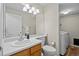 Bathroom featuring updated vanity and a stacked washer and dryer at 20858 E Progress Ave, Centennial, CO 80015