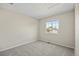 Neutral bedroom with carpet, window, and light colored walls at 20858 E Progress Ave, Centennial, CO 80015