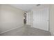 Bedroom with neutral walls, carpet flooring, a closet, and access to the hallway at 20858 E Progress Ave, Centennial, CO 80015