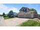 Attractive two-story home with a large driveway and well-kept lawn at 20858 E Progress Ave, Centennial, CO 80015