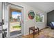 Inviting foyer with wood floors, a stylish table, and a view of the front yard at 20858 E Progress Ave, Centennial, CO 80015