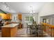 Bright eat-in kitchen features wood cabinets and modern appliances at 20858 E Progress Ave, Centennial, CO 80015