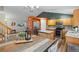 Open-concept kitchen and dining area with stainless steel appliances and stylish decor at 20858 E Progress Ave, Centennial, CO 80015