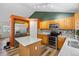 Spacious kitchen with stainless steel appliances, center island, and ample cabinet storage at 20858 E Progress Ave, Centennial, CO 80015