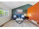 Comfortable living room featuring a blue sofa, modern decor, and a view of the backyard at 20858 E Progress Ave, Centennial, CO 80015