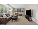Comfortable living room with a fireplace, sofa, and large TV for relaxing evenings at 20858 E Progress Ave, Centennial, CO 80015