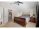 Comfortable bedroom featuring neutral tones, vaulted ceiling, carpet flooring, and ensuite bath at 20858 E Progress Ave, Centennial, CO 80015