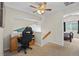 Well-lit home office with desk, chair, and view of bedroom at 20858 E Progress Ave, Centennial, CO 80015