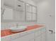 Bathroom with updated sink, orange tile, and white cabinets at 130 N Pearl St # 404, Denver, CO 80203