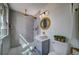 Bright bathroom features a walk-in shower, unique tiling, and stylish fixtures at 4267 Federal Blvd, Denver, CO 80211