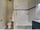 Beautiful bathroom with a tub, sleek vanity, updated fixtures, and patterned tile floor at 4267 Federal Blvd, Denver, CO 80211