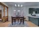 Eat-in kitchen adjacent to updated kitchen features updated cabinets and modern finishes at 4267 Federal Blvd, Denver, CO 80211