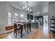 Eat-in kitchen adjacent to updated kitchen featuring updated cabinets and modern finishes at 4267 Federal Blvd, Denver, CO 80211