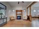 Inviting living room with hardwood floors, decorative fireplace, and charming details at 4267 Federal Blvd, Denver, CO 80211
