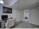Cozy carpeted basement office features neutral tones, modern desk, and a chair, perfect for a study at 4267 Federal Blvd, Denver, CO 80211
