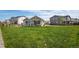 Expansive backyard featuring a covered patio and lush green lawn, perfect for recreation and relaxation at 944 Alpine Ridge St, Erie, CO 80516