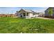 Well-manicured backyard with a covered patio, ideal for enjoying outdoor activities and gatherings at 944 Alpine Ridge St, Erie, CO 80516